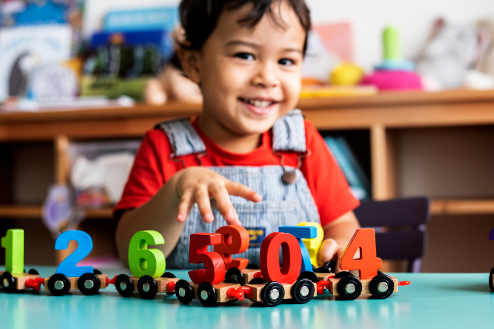 Little,Boy,Playing,Mathematics,Wooden,Toy,At,Nursery